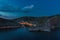 Night Balaclava town. Panorama of the night town with a small illumination of the building on the shore of the sea bay near the