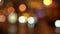 Night blurred city lights background. Abstract urban street cityscape in bokeh effect. Moving cars in the evening