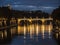 Night on bridge Giuseppe Mazzini and the Fiume Tevere river in Rome Italy