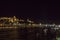 Night Budapest at the river Danube. Buda Castle Royal Palace and Chain bridge Szechenyi lanchid on background. Hungary