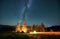 Night camping in mountains under starry sky with Milky way.