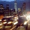 Night car traffic in New York City street. People in the cars driving back home from Manhattan after the work