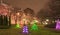 Night christmas background, christmas city illumination. Christmas neon tree in downtown.