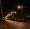 Night city life: road and street lamps, retro style. Small town Phang Nga, Thailand