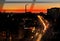 Night city light traffic at orange sunset building and traffic urban panorama  Tallinn Estonia