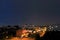 Night city panorama from the height of the 12th floor overlooking the Volga Orthodox Institute and the Church of the Three Saints.