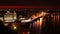 Night city quay, ferry boat docking, city lights, cars