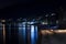 Night city in the reflection of the water of the sea. Black night, highlands, Abkhazia, tourism, travel, night city
