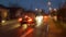 Night city road through windshield cars abstract background water drop on the glass lights and rain