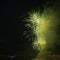 Night city sky bright explosion green fireworks