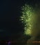 Night city sky explosion fireworks above river