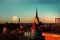 Night city  Tallinn old town red roofs medieval panorama  moon skyline  clouds blue sky sun down summer  weather Baltic sea on hor