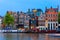 Night city view of Amsterdam canal with dutch houses