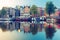 Night city view of Amsterdam canal with dutch houses