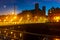 Night cityscape of Besancon overlooking Battant bridge and Sainte Madeleine church, France