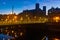 Night cityscape of Besancon overlooking Battant bridge and Sainte Madeleine church, France