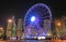 Night cityscape and ferris wheel Hong Kong