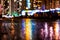 Night cityscape, lights reflected in the wet asphalt after rain.