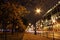 Night cityscape oldtown houses and street with cars light trails