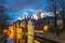 Night cityscape with a tower Belfort and the Green