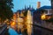 Night cityscape with a tower Belfort and the Green canal in Brug