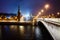 Night cityscape view of Moscow Kremlin, Vasilievsky Spusk and Red Square, embankment, street lights at winter snowfall, Russia.