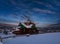 Night countryside hills, groves and farmlands in winter remote alpine mountain village. Ukraine, Voronenko