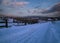 Night countryside road, hoases, hills, groves and farmlands in winter remote alpine mountain village. Ukraine, Voronenko