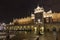 Night facade of Sukiennice building in Krakow old town, Poland.