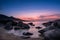 Night falling over beach and village of Algajola in Corsica