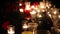 Night frames of the memorial with candles and flowers. The place of death in a terrorist attack. Grief and compassion of