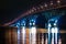 Night graceful bridge with arches and blue illumination