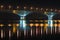 Night graceful bridge with arches and blue illumination