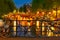 Night illumination of Amsterdam canal and bridge