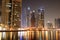 The night illumination at Dubai Marina and Cayan Tower