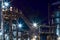 Night industrial petrochemical landscape. Reactors pipes stairs and columns. Large-capacity production enterprise