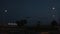 Night Landscape. Shot. Passenger plane over night sea. Plane is landing at night over the sea