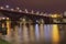 Night landscape view of illuminated Old Bridge also named the State over Drava River. Popular travel destination in Maribor