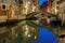 Night lateral canal and bridge in Venice, Italy