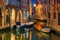 Night lateral canal and bridge in Venice, Italy