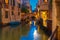 Night lateral canal and bridge in Venice, Italy