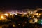 Night light aerial landscape view of famous cave city Goreme. Scenic view of illuminated buildings