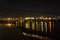 Night lights of the bridge in Nur-Sultan city former Astana reflected