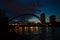 Night lights - harbor bridge, river, water reflection and evening sky