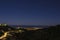 Night panorama above quiet touristic town on mediteranean shore