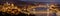 Night panorama of Budapest city - capital of Hungary. Parliament building on right, Buda castle hill on left and Chain bridge in m