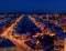 Night panorama of the city of Togliatti overlooking residential buildings and smoking pipes of chemical plants.