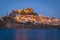 Night panorama of famous medieval town of Castelsardo, Sardinia, Italy