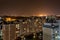 Night panorama of Light in the windows of a multistory building. life in a big city