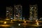 Night panorama of Light in the windows of a multistory building. life in a big city